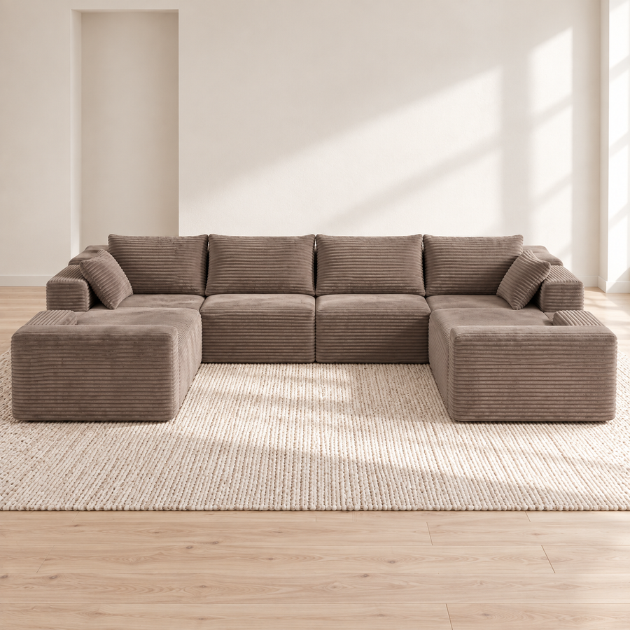 Oversized taupe corduroy U-sectional in a bright Nordic interior